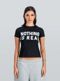 NOTHING IS REAL Baby Tee